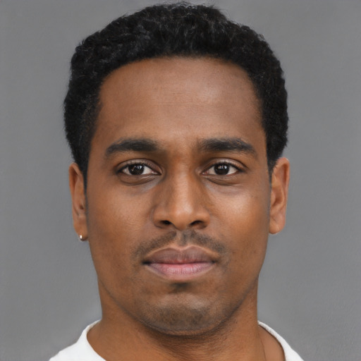Neutral black young-adult male with short  black hair and brown eyes