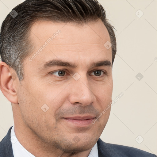 Joyful white adult male with short  brown hair and brown eyes