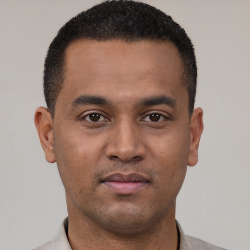 Neutral latino young-adult male with short  black hair and brown eyes