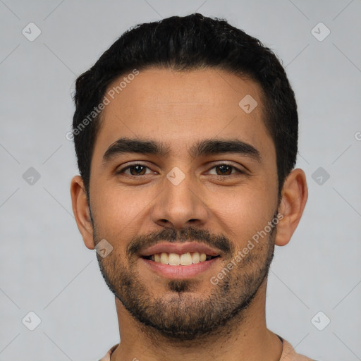 Joyful latino young-adult male with short  black hair and brown eyes