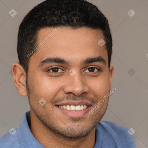 Joyful latino young-adult male with short  brown hair and brown eyes