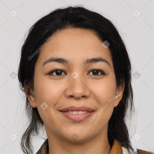 Joyful latino young-adult female with medium  brown hair and brown eyes