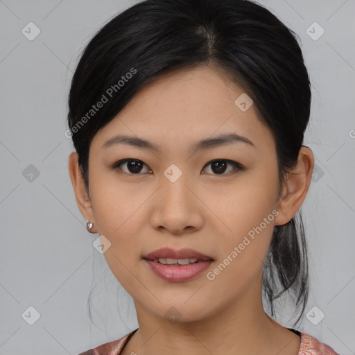 Joyful asian young-adult female with medium  black hair and brown eyes