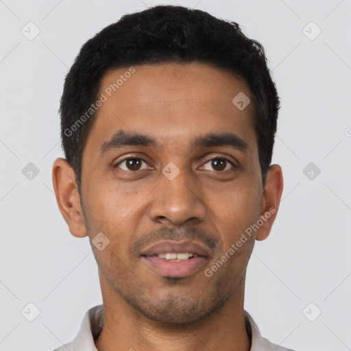 Joyful latino young-adult male with short  black hair and brown eyes