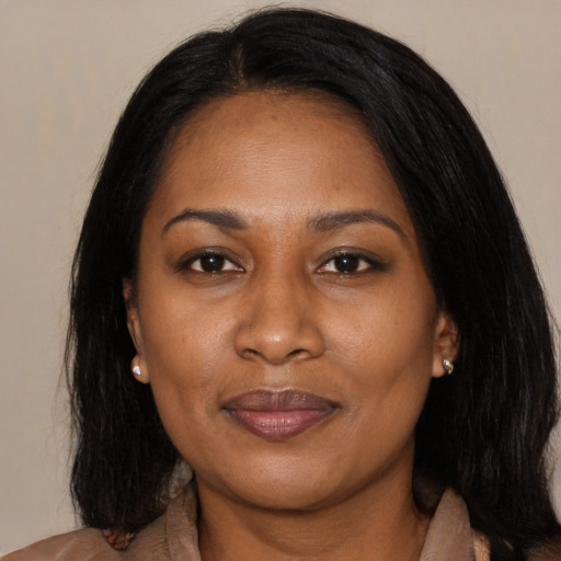 Joyful asian adult female with medium  black hair and brown eyes