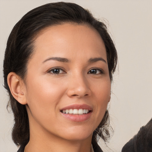 Joyful white young-adult female with long  brown hair and brown eyes