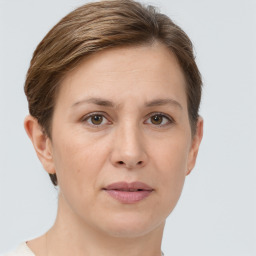 Joyful white adult female with short  brown hair and brown eyes