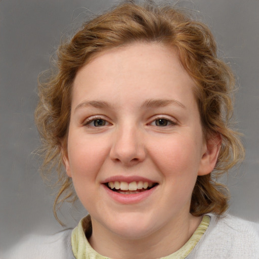 Joyful white young-adult female with medium  brown hair and blue eyes