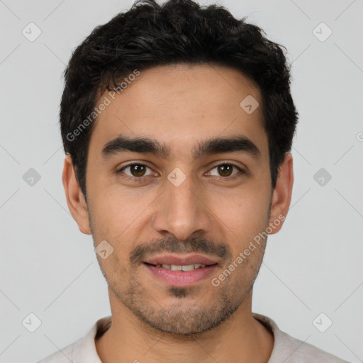 Joyful white young-adult male with short  black hair and brown eyes