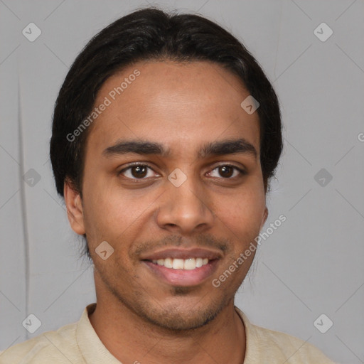 Joyful latino young-adult male with short  brown hair and brown eyes