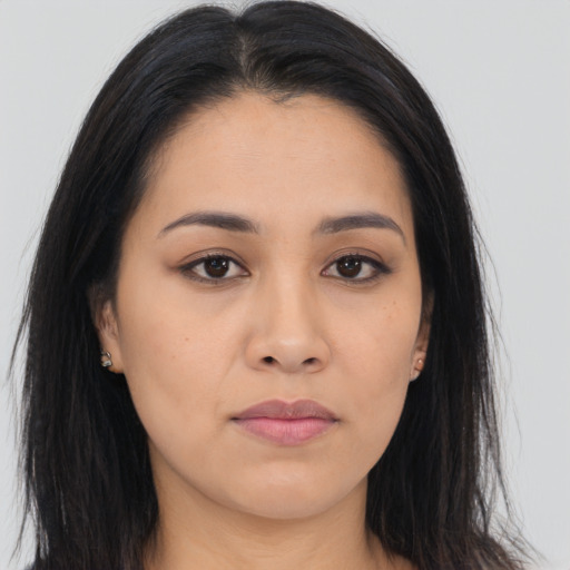 Joyful asian young-adult female with long  brown hair and brown eyes