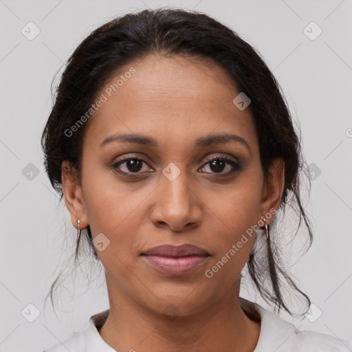 Joyful latino young-adult female with medium  brown hair and brown eyes