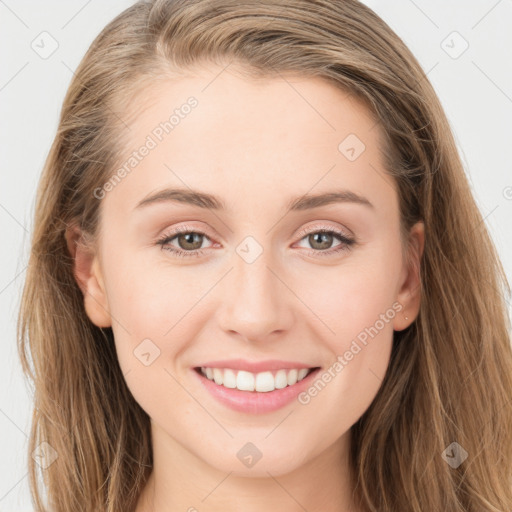 Joyful white young-adult female with long  brown hair and blue eyes