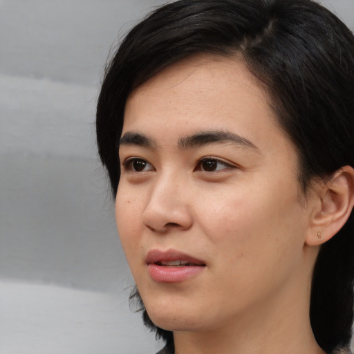 Neutral asian young-adult female with medium  black hair and brown eyes