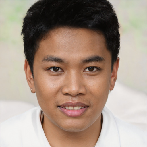 Joyful asian young-adult male with short  brown hair and brown eyes