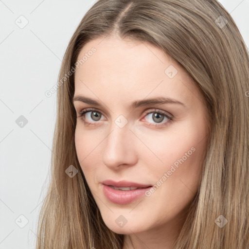 Neutral white young-adult female with long  brown hair and brown eyes