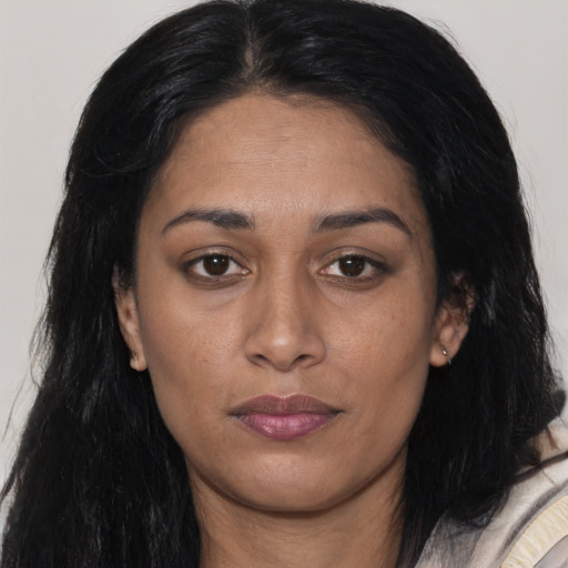 Joyful asian young-adult female with long  black hair and brown eyes