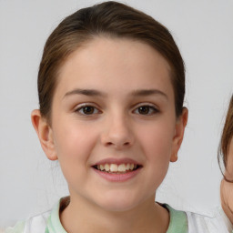 Joyful white child female with short  brown hair and brown eyes