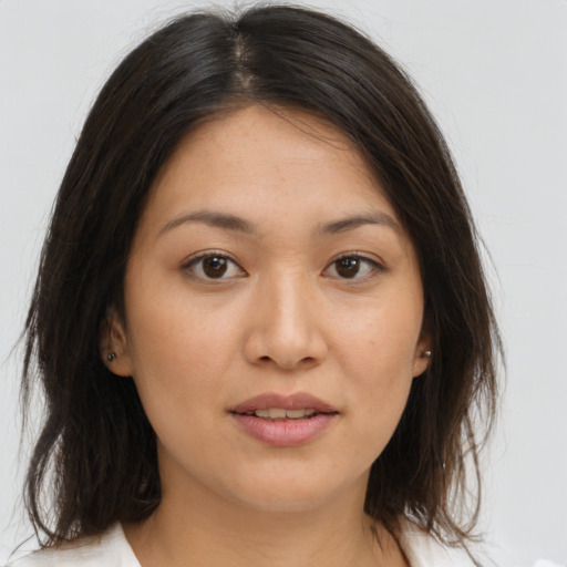 Joyful white young-adult female with medium  brown hair and brown eyes