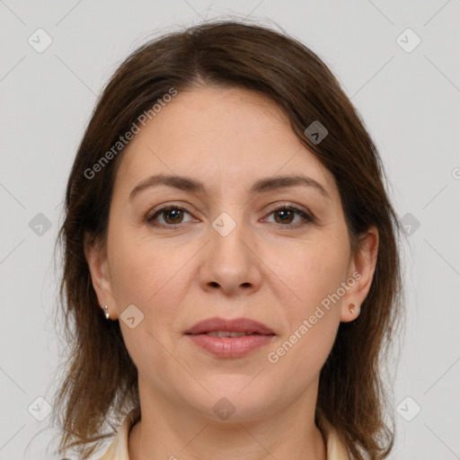 Joyful white adult female with medium  brown hair and brown eyes