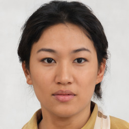 Neutral asian young-adult female with medium  brown hair and brown eyes