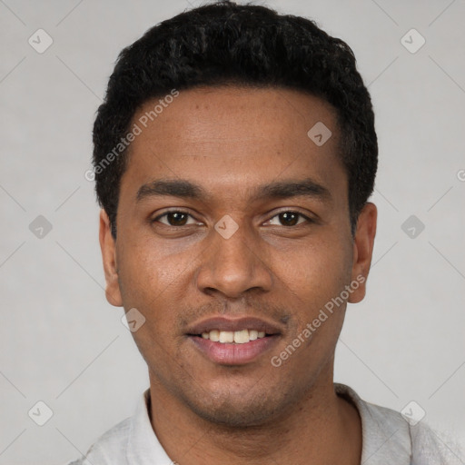 Joyful latino young-adult male with short  black hair and brown eyes