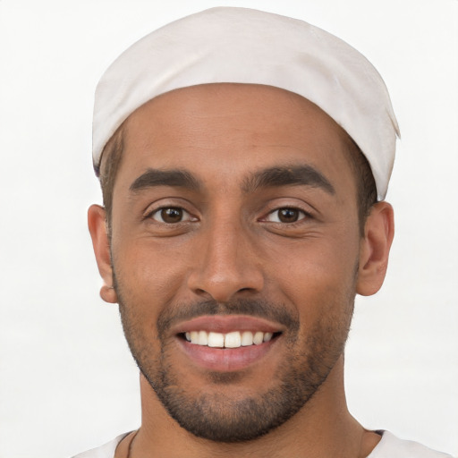 Joyful white young-adult male with short  black hair and brown eyes