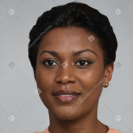 Joyful black young-adult female with short  black hair and brown eyes