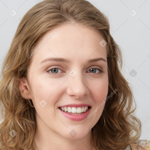 Joyful white young-adult female with long  brown hair and green eyes