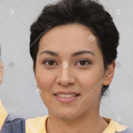 Joyful asian young-adult female with short  brown hair and brown eyes