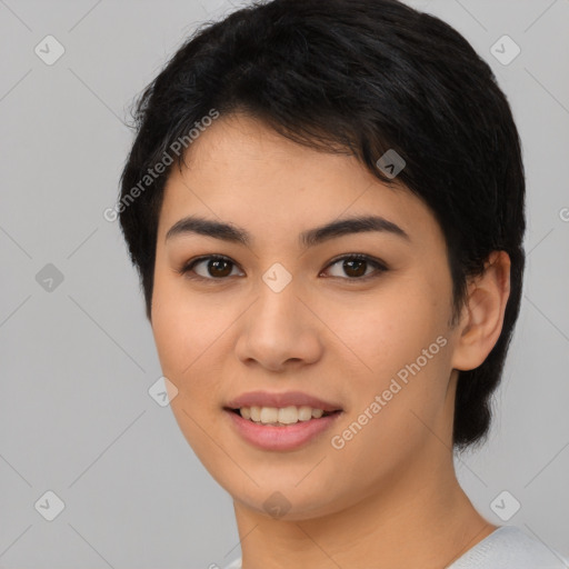 Joyful asian young-adult female with short  black hair and brown eyes