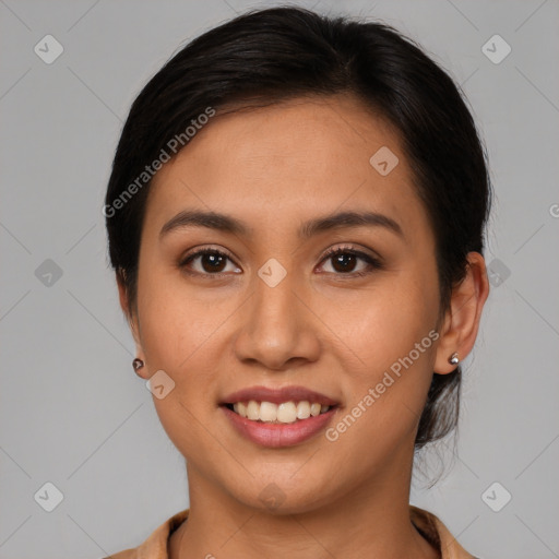 Joyful latino young-adult female with medium  brown hair and brown eyes