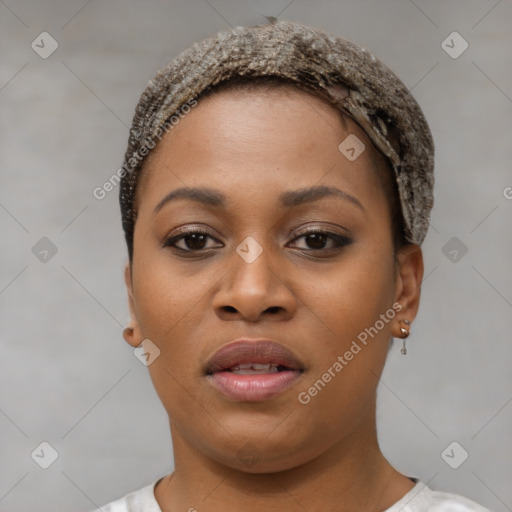 Joyful black young-adult female with short  brown hair and brown eyes