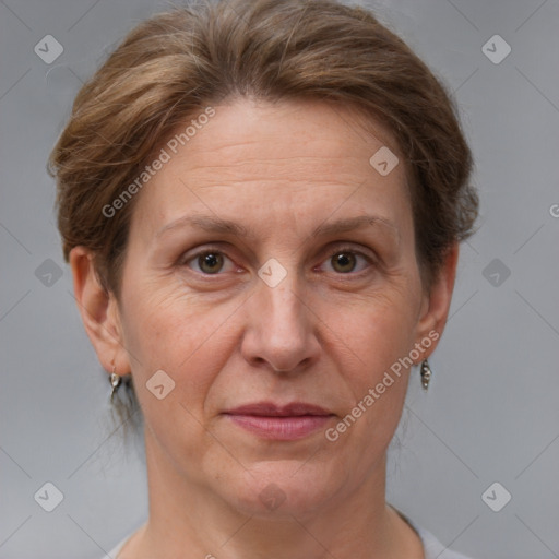 Joyful white adult female with short  brown hair and grey eyes