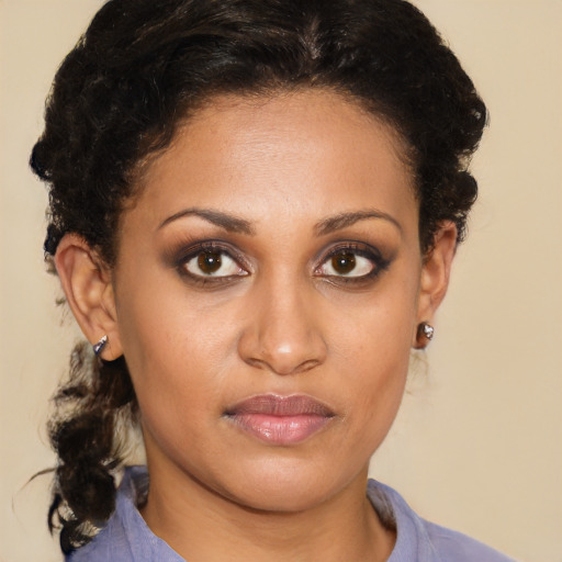 Joyful black young-adult female with medium  brown hair and brown eyes