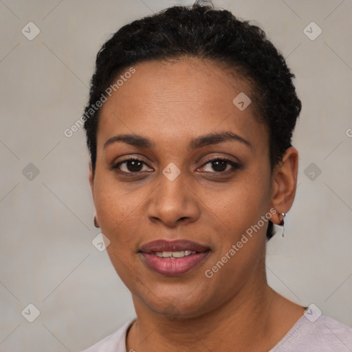 Joyful latino young-adult female with short  black hair and brown eyes