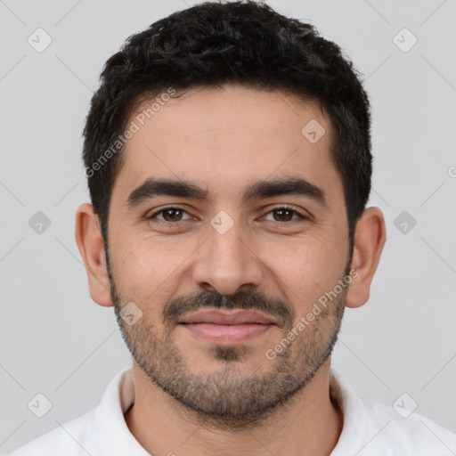 Joyful white young-adult male with short  black hair and brown eyes