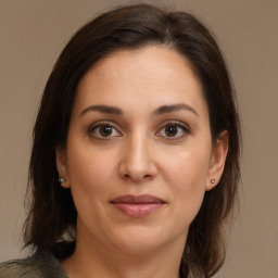 Joyful white young-adult female with medium  brown hair and brown eyes