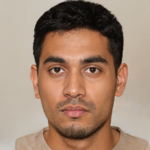 Neutral latino young-adult male with short  black hair and brown eyes