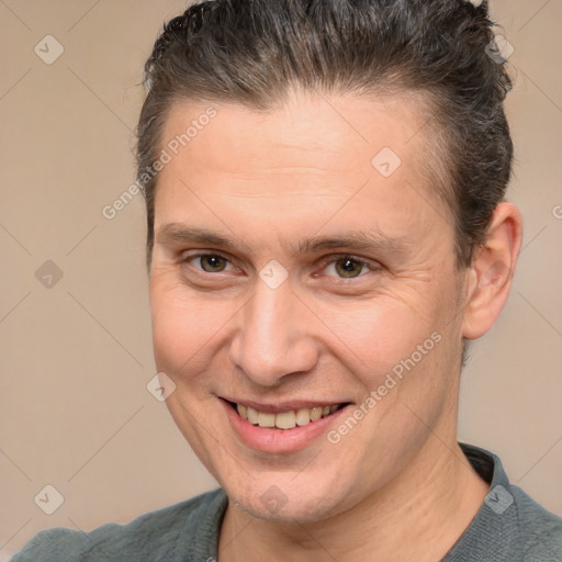 Joyful white adult male with short  brown hair and brown eyes