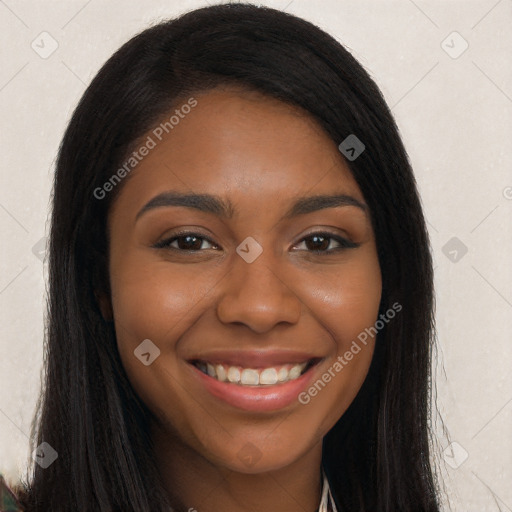 Joyful black young-adult female with long  brown hair and brown eyes