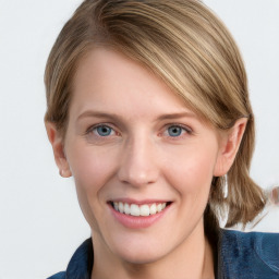 Joyful white young-adult female with medium  brown hair and blue eyes