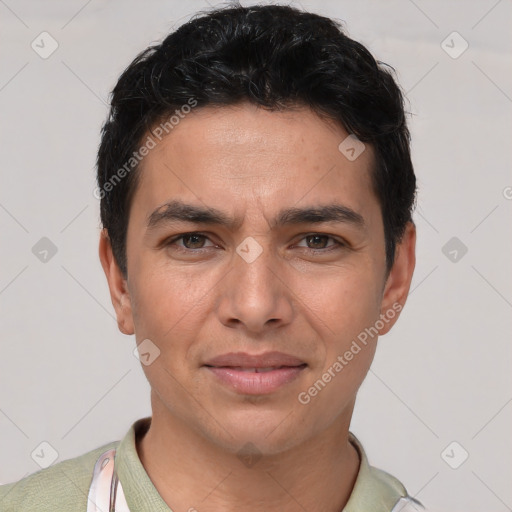 Joyful white young-adult male with short  black hair and brown eyes