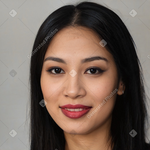 Joyful latino young-adult female with long  black hair and brown eyes