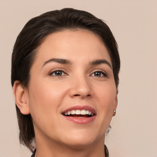 Joyful white young-adult female with medium  brown hair and brown eyes