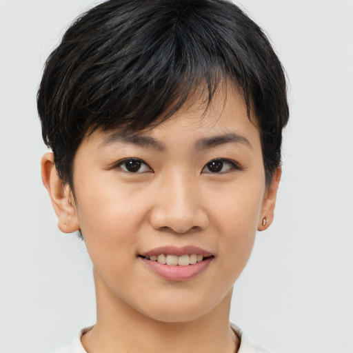 Joyful asian young-adult female with short  brown hair and brown eyes