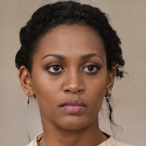 Neutral black young-adult female with medium  brown hair and brown eyes