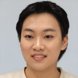 Joyful asian young-adult female with short  black hair and brown eyes