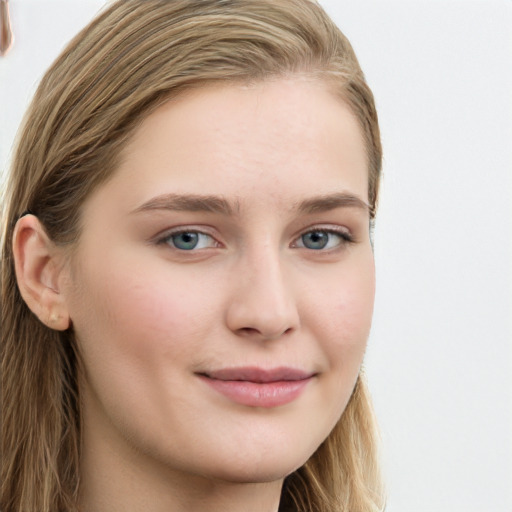 Joyful white young-adult female with long  brown hair and blue eyes