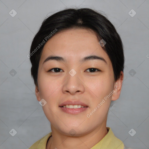 Joyful asian young-adult female with short  black hair and brown eyes